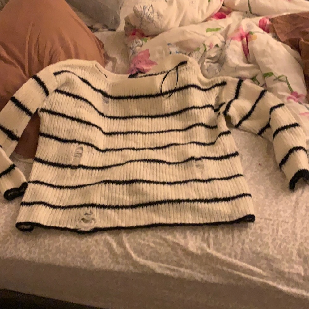 Women’s black and white striped ripped sweater